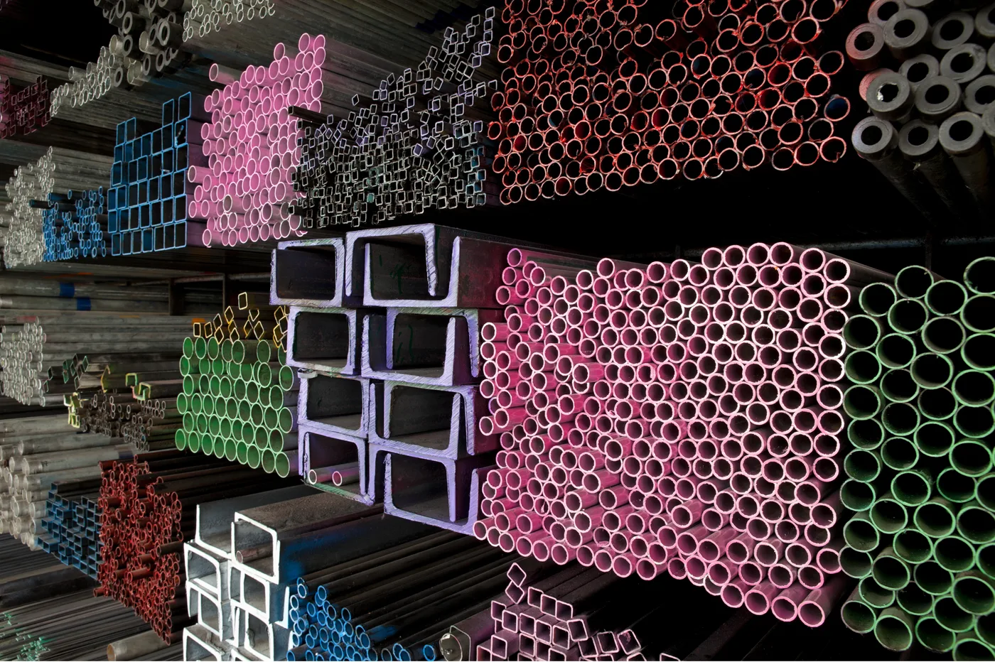 Colour-marked steel pipes and channel profiles illustrating Madhur channels