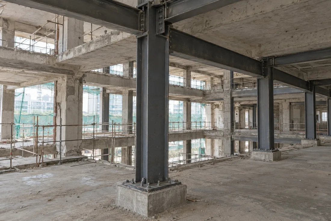 Steel beams in a building frame, illustrating a beam application, not a documented Madhur project